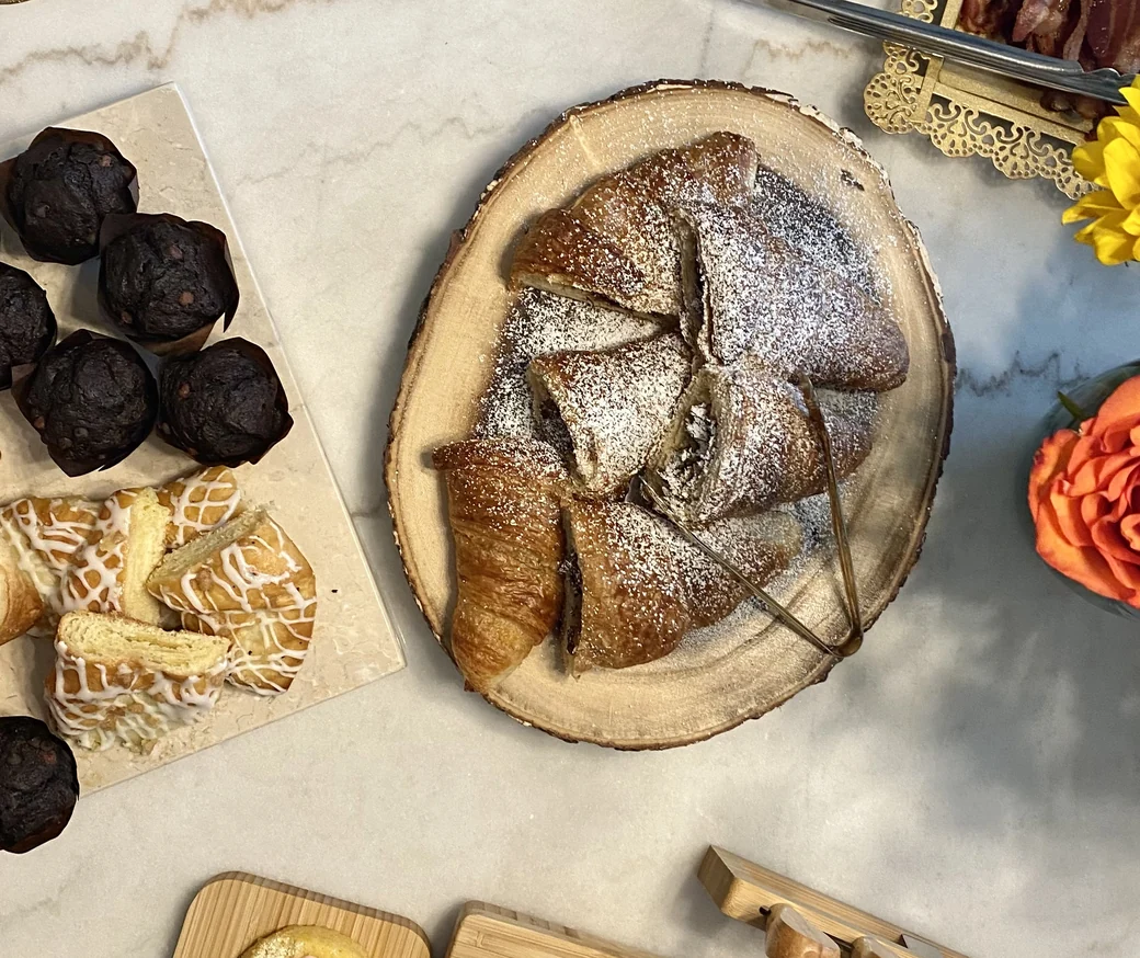 Croissants, pastries and muffins from a BlendedSoul spread