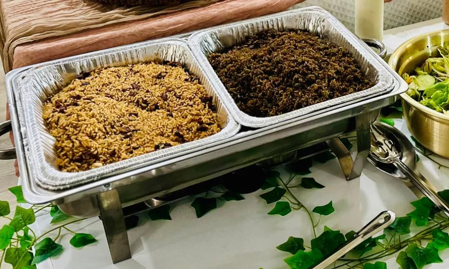 Chafing pans of Haitian rice and beans and Riz Djon Djon